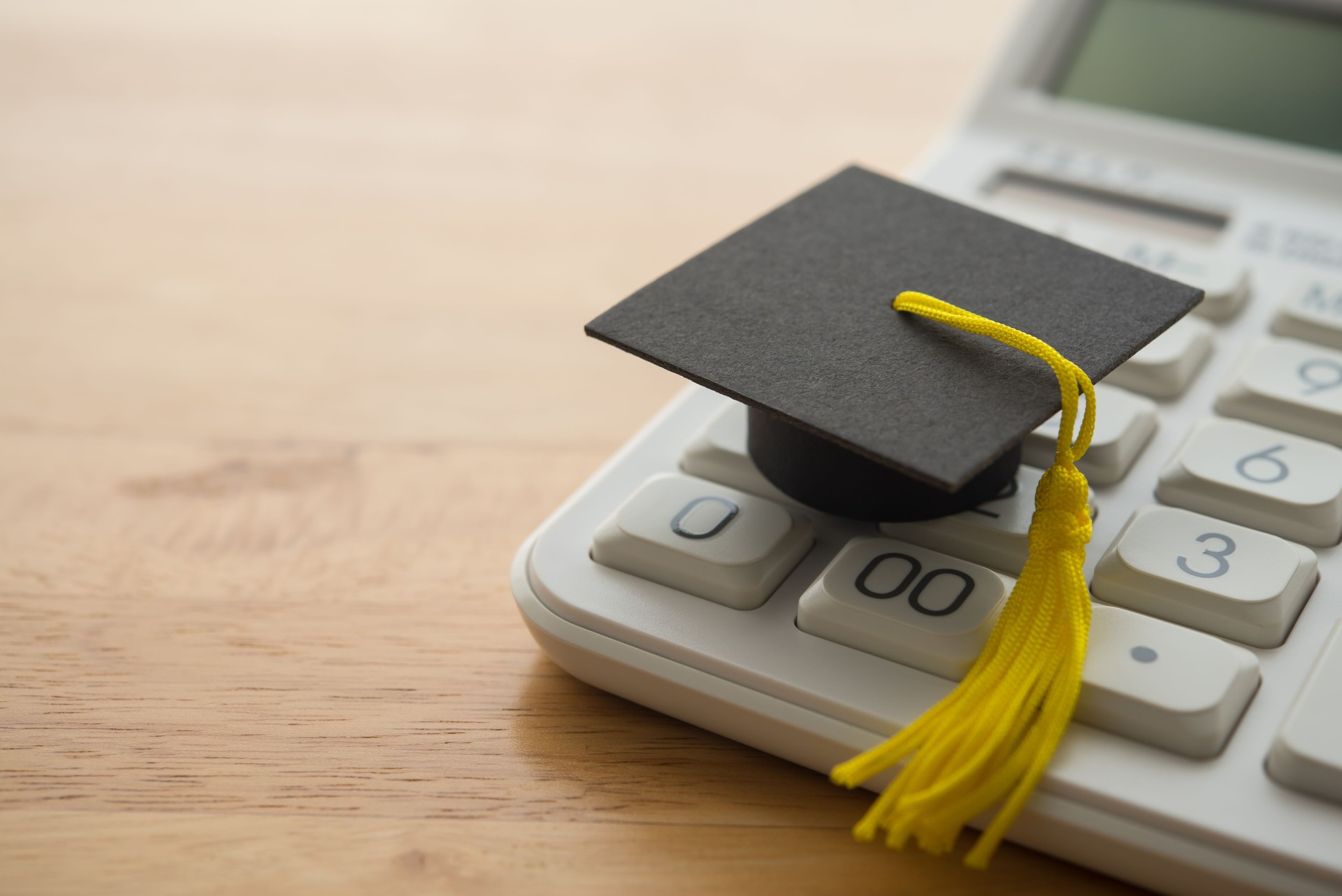 Mortarboard on calculator.